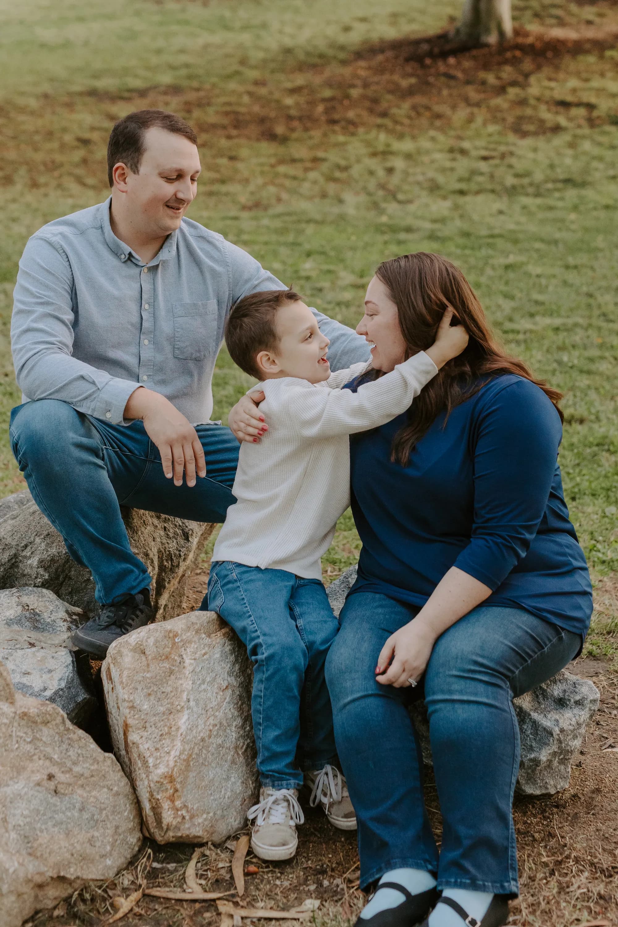 A family laughing together outdoors in Oceanside